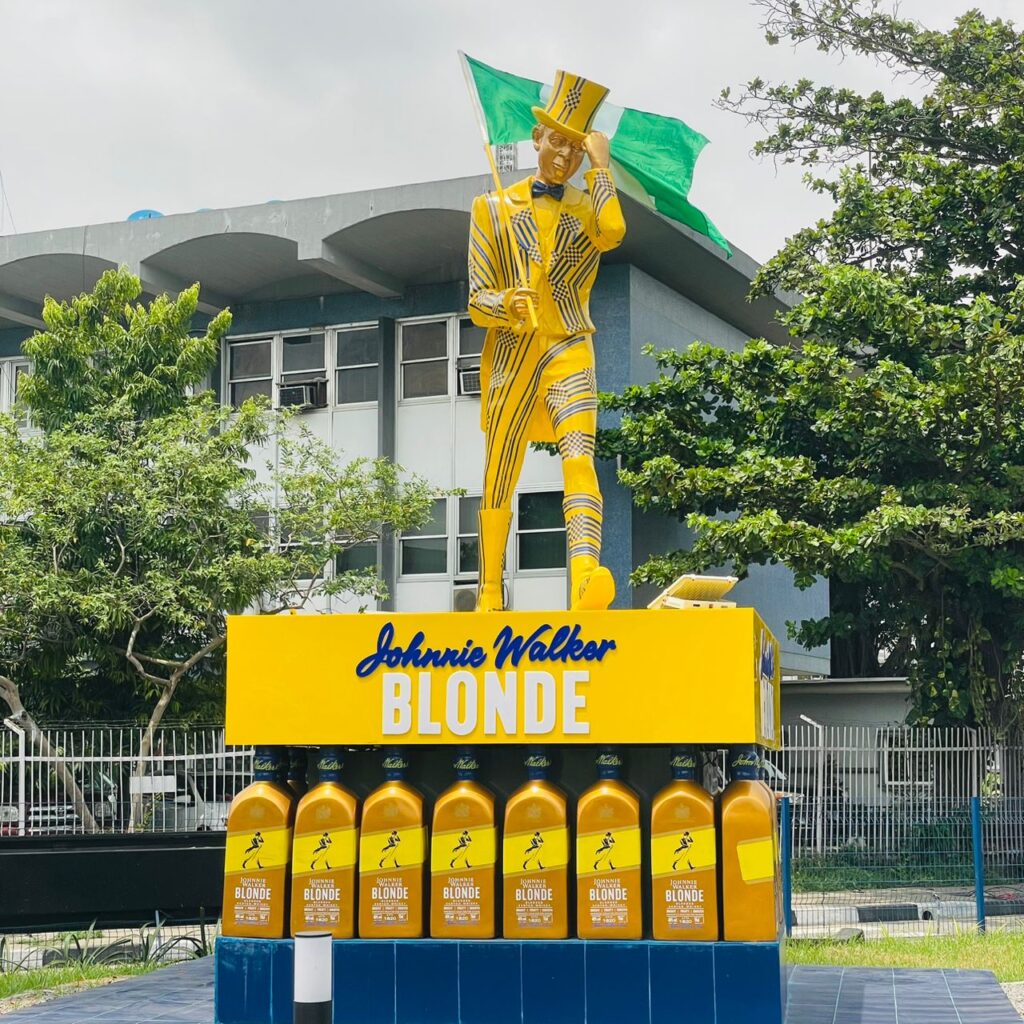 Custom fiberglass Johnnie Walker brand sculpture installed at TBS, Lagos by Dipsy Fiberglass